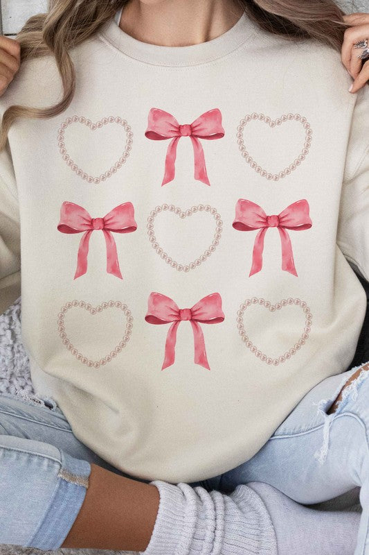 HEARTS AND BOWS PEARL GRAPHIC SWEATSHIRT